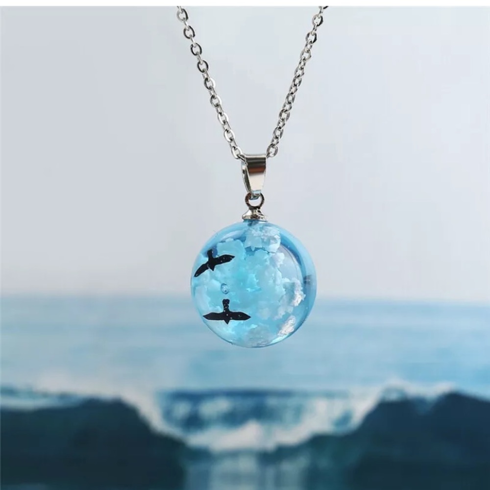 Blue Glass Orb Necklace with Seagull Silhouette